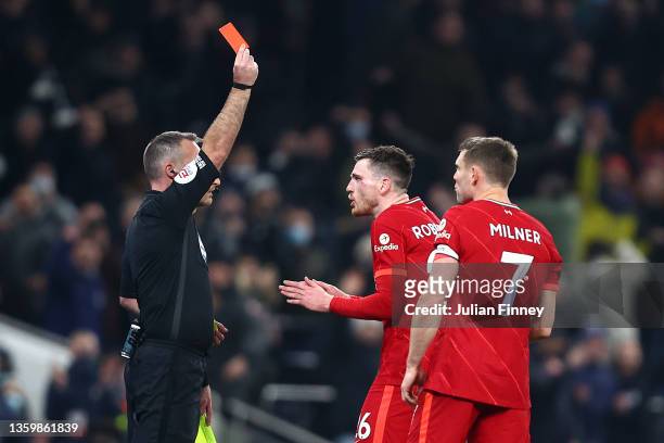 Referee Paul Tierney shows a red card to Andrew Robertson of Liverpool during the Premier League match between Tottenham Hotspur and Liverpool at...