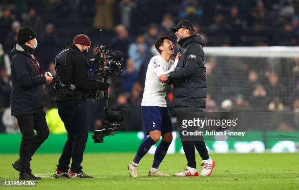 Heung-Min Son of Tottenham Hotspur laughs with Juergen Klopp, Manager of Liverpool after the Premier League match between Tottenham Hotspur and...