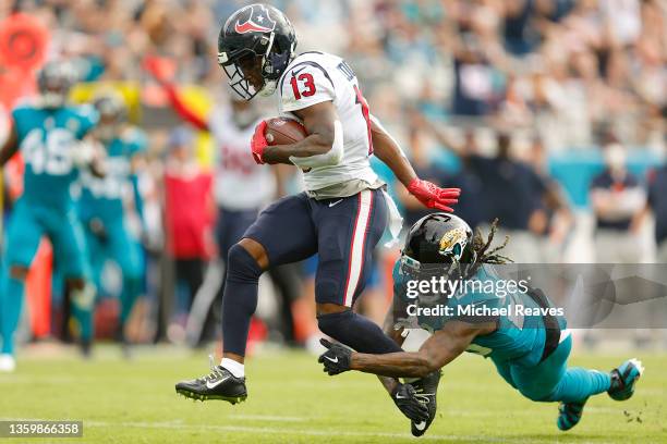 Brandin Cooks of the Houston Texans breaks a tackle by Shaquill Griffin of the Jacksonville Jaguars and scores a touchdown during the first quarter...