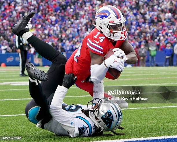 Stefon Diggs of the Buffalo Bills catches an eleven-yard pass over Stephon Gilmore of the Carolina Panthers and runs in for a touchdown in the second...