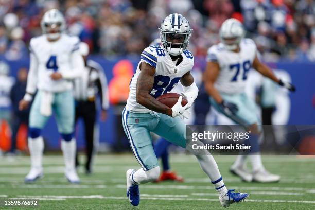 CeeDee Lamb of the Dallas Cowboys runs the ball after a catch during the third quarter against the New York Giants at MetLife Stadium on December 19,...