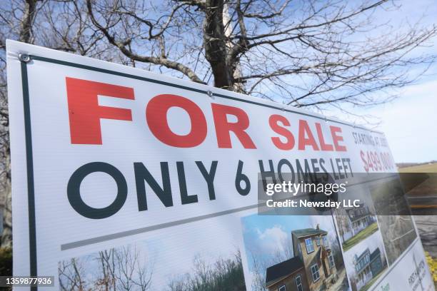 For sale sign for 6 new homes on A.J. Court in Riverhead, New York is shown on Saturday, March 14, 2020.