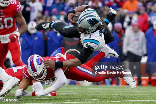 Cam Newton of the Carolina Panthers is tackled by Micah Hyde of the Buffalo Bills on a first down run in the third quarter of the game at Highmark...