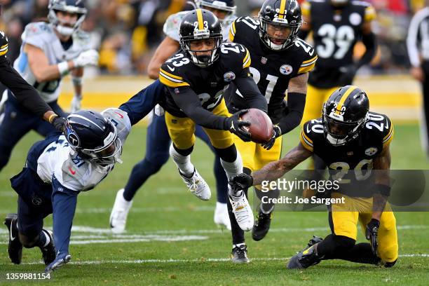 Joe Haden of the Pittsburgh Steelers recovers a fumble by Racey McMath of the Tennessee Titans in the third quarter of the game at Heinz Field on...