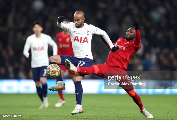 Naby Keita of Liverpool tackles Lucas Moura of Tottenham during the Premier League match between Tottenham Hotspur and Liverpool at Tottenham Hotspur...