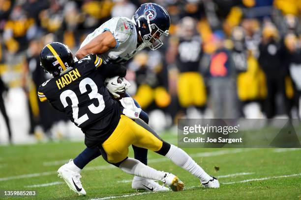 Nick Westbrook-Ikhine of the Tennessee Titans is stopped on fourth down by Joe Haden of the Pittsburgh Steelers in the fourth quarter to end the game...