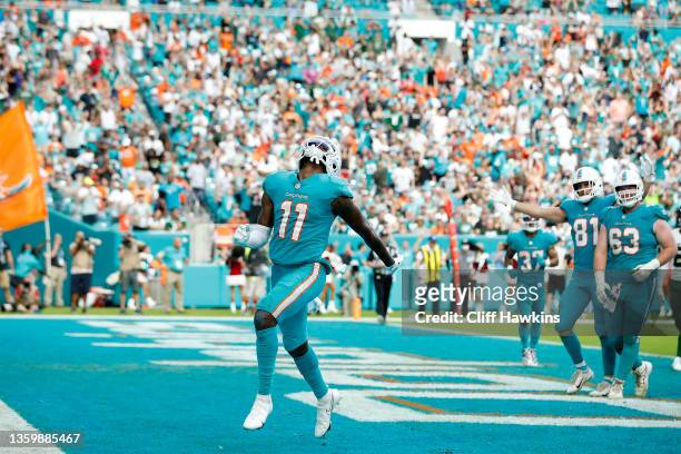 DeVante Parker of the Miami Dolphins reacts after his fourth quarter receiving touchdown against the New York Jets at Hard Rock Stadium on December...