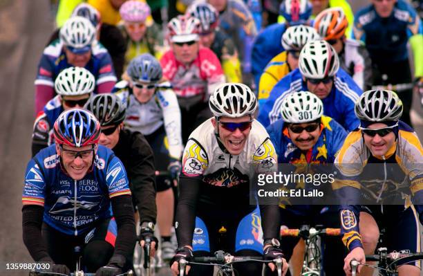 View of American cyclist Lance Armstrong as he participates, with an unidentified rider, in his annual Ride for the Roses, Texas, October 24, 2003....