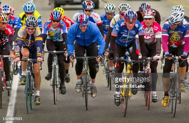 View of American cyclist Lance Armstrong as he participates, with unidentified others, in his annual Ride for the Roses, Texas, October 24, 2003. The...