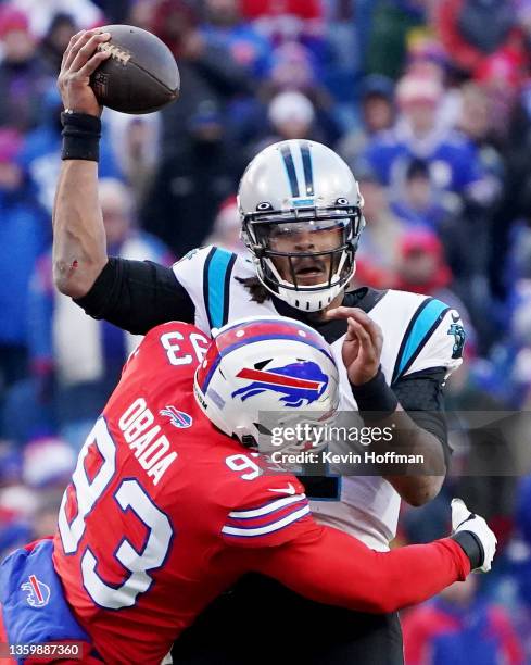 Cam Newton of the Carolina Panthers is sacked by Efe Obada of the Buffalo Bills in the fourth quarter of the game at Highmark Stadium on December 19,...