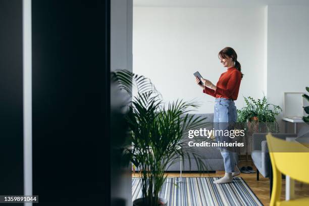 beautiful woman using digital tablet for online class at home - virtual meeting room stock pictures, royalty-free photos & images