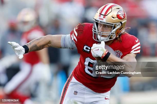 George Kittle of the San Francisco 49ers carries the ball against the Atlanta Falcons in the first half of the game at Levi's Stadium on December 19,...