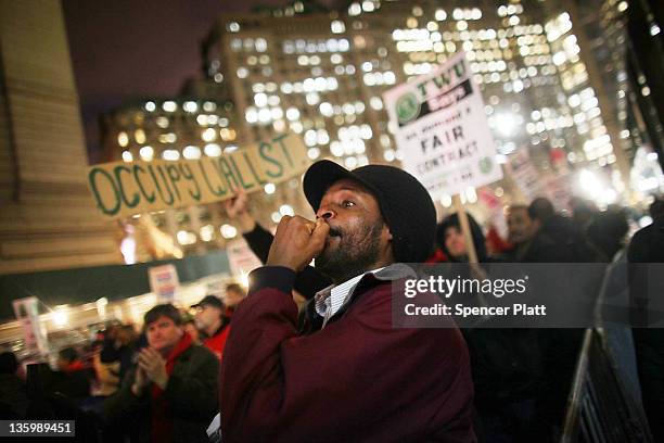 Members of the Transportation Union Local 100 and supporters from "Occupy Wall Street" participate in a protest before marching to Zuccotti Park to...