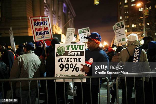 Members of the Transportation Union Local 100 and supporters from "Occupy Wall Street" participate in a protest before marching to Zuccotti Park to...