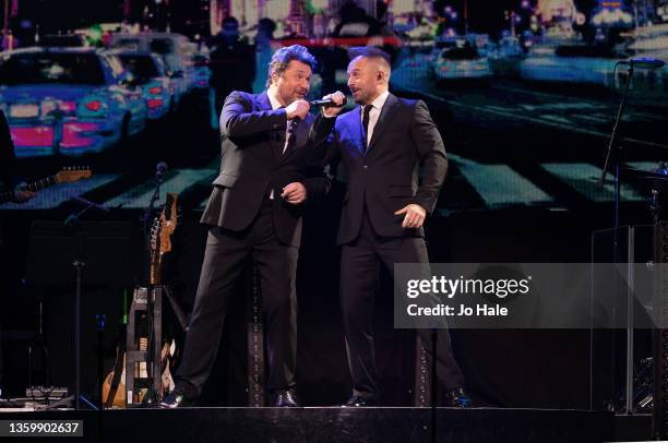 Michael Ball and Alfie Boe perform on stage at The O2 Arena on December 19, 2021 in London, England.