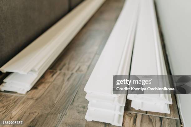 combination of wooden skirting boards over white - panela bildbanksfoton och bilder