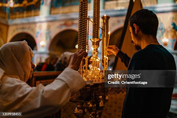 citizens are worshipping in rthodox church of the holy trinity,kamchatka,russia. - oosters orthodoxe kerk stockfoto's en -beelden