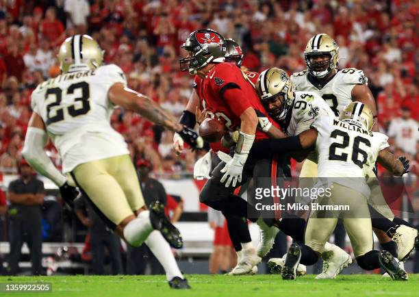 Tom Brady of the Tampa Bay Buccaneers fumbles the ball as he is hit by Cameron Jordan of the New Orleans Saints during the 4th quarter of the game at...