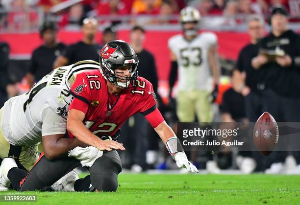Tom Brady of the Tampa Bay Buccaneers fumbles the ball as he is hit by Cameron Jordan of the New Orleans Saints during the 4th quarter of the game at...