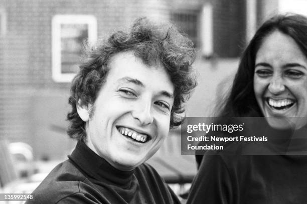 Folk singers Bob Dylan and Joan Baez at the Viking Hotel before performing at the Newport Folk Festival on July 26, 1964 in Newport, Rhode Island.