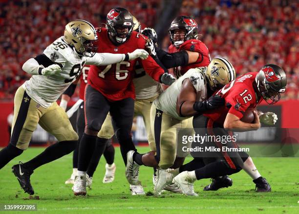 Tom Brady of the Tampa Bay Buccaneers is sacked by David Onyemata of the New Orleans Saints during the 4th quarter of the game at Raymond James...