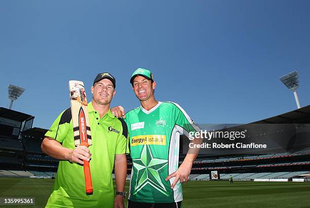 David Warner of the Sydney Thunder and Shane Warne of the Melbourne Stars pose for the media during a Big Bash League media session at Melbourne...