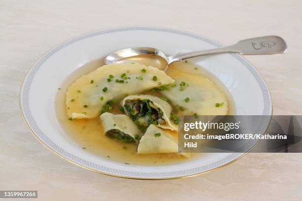 swabian cuisine, maultaschen in broth with chives, soup plate, spoon, germany - maultaschen stock pictures, royalty-free photos & images