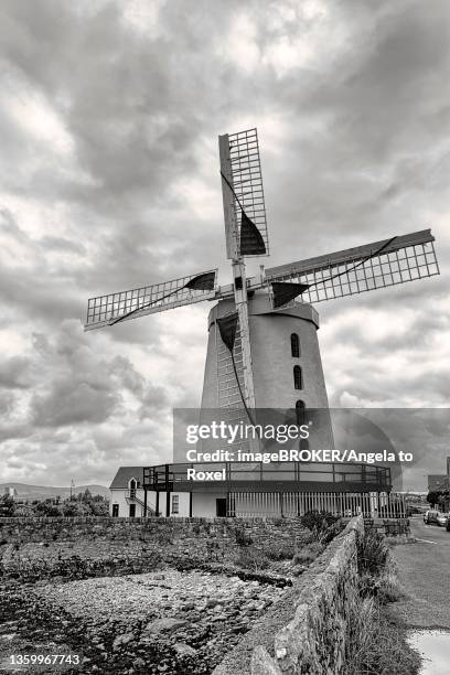 blennerville five storey windmill, dramatic cloudy sky, blennerville, tralee, kerry, ireland - blennerville windmill stock pictures, royalty-free photos & images