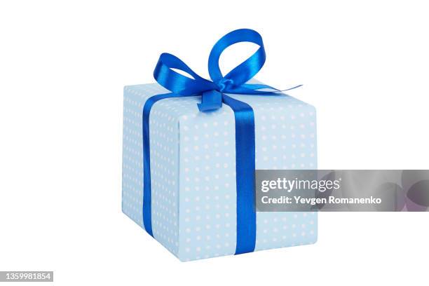 gift box wrapped in blue paper with blue ribbon bow, isolated on white - wrap up stock pictures, royalty-free photos & images