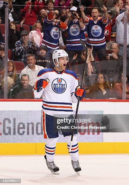 Taylor Hall of the Edmonton Oilers celebrates after scoring a third period goal against the Phoenix Coyotes during the NHL game at Jobing.com Arena...