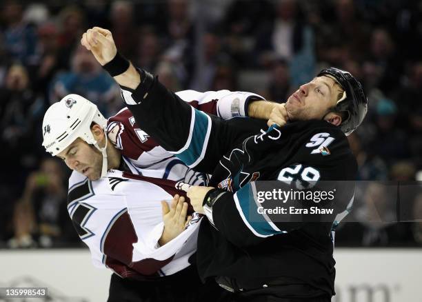 Daniel Winnik of the Colorado Avalanche and Ryane Clowe of the San Jose Sharks fight during their game at HP Pavilion at San Jose on December 15,...