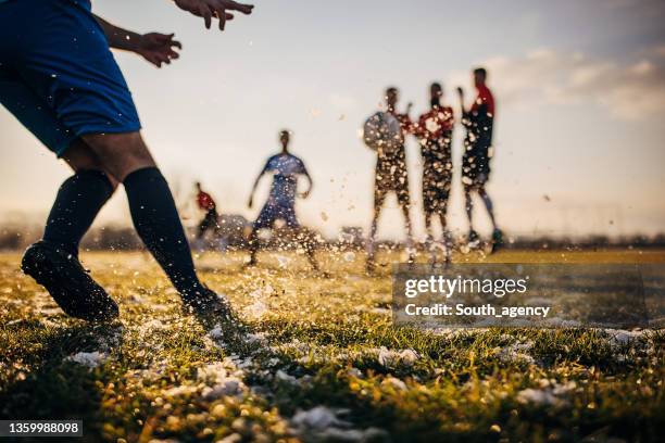 soccer player performs free kick - defender soccer stock pictures, royalty-free photos & images