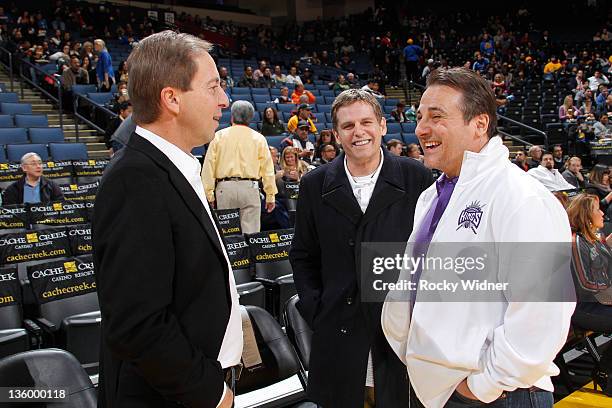 Golden State Warriors owner Joe Lacob and Sacramento Kings owners Joe Maloof and Gavin Maloof chat before a preseason game on December 17, 2011 at...