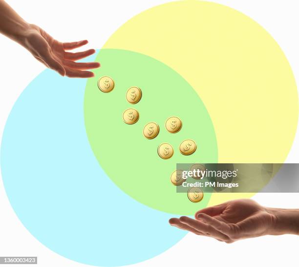hands exchanging cyber coins - generosidad fotografías e imágenes de stock