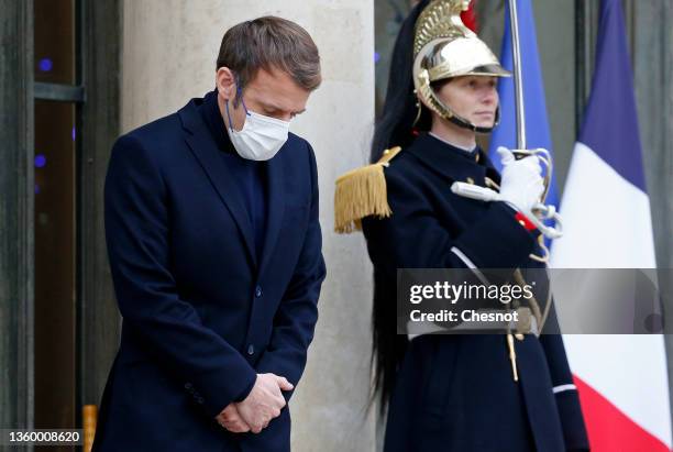 French President Emmanuel Macron wearing a protective face mask waits for Rwanda's President Paul Kagame prior to their working lunch at the...