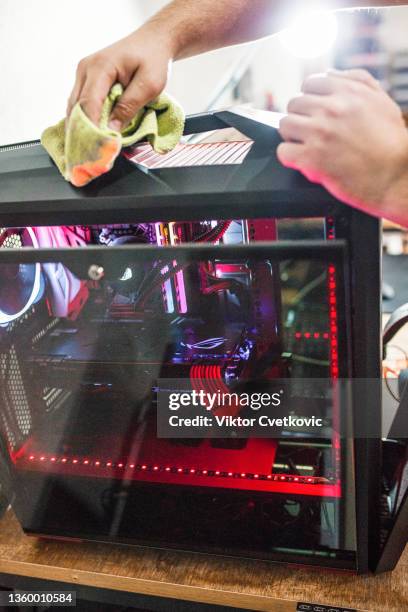 expert man cleaning computer case after assembling it - computer tower stock pictures, royalty-free photos & images