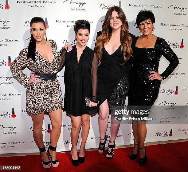Television personalities Kim Kardashian, Kourtney Kardashian, Khloe Kardashian and Kris Jenner arrive at the grand opening of the Kardashian Khaos...