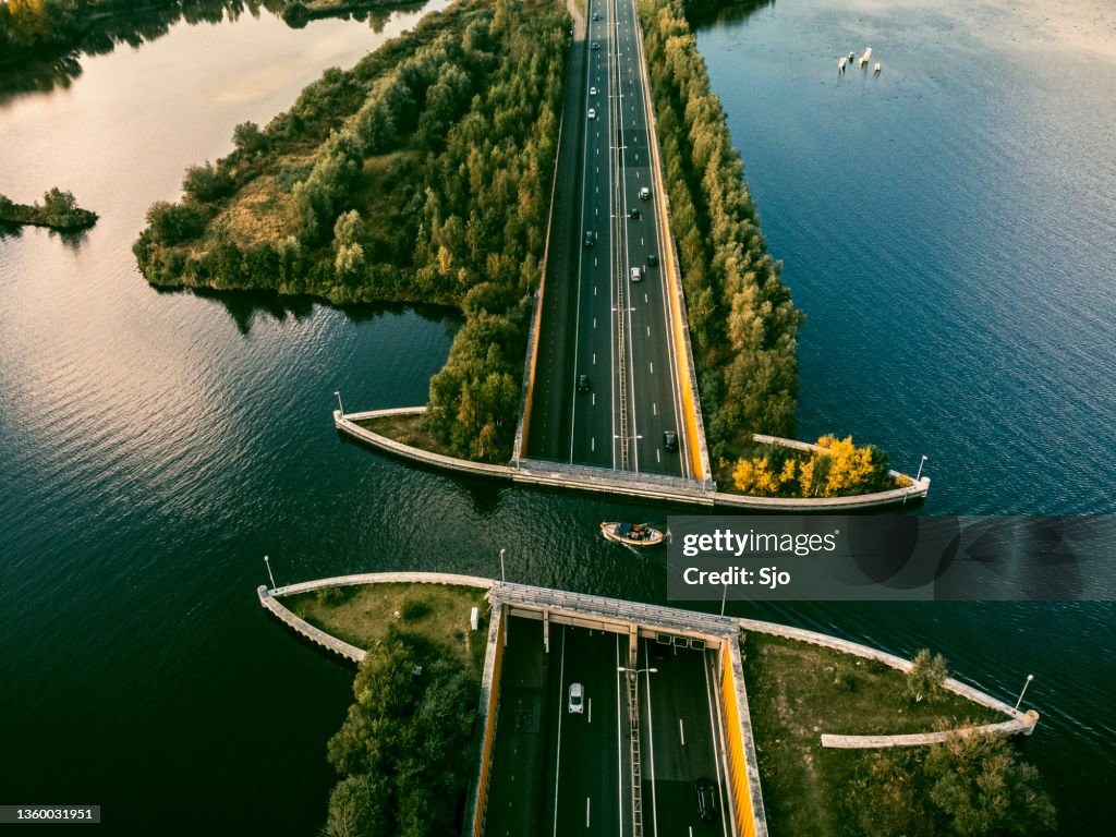 Aquaduct Veluwemeer in the Veluwe lake with a boat sailing in the canal