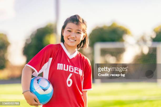 portrait of elementary age female football or soccer player - japan 12 years girl stock pictures, royalty-free photos & images