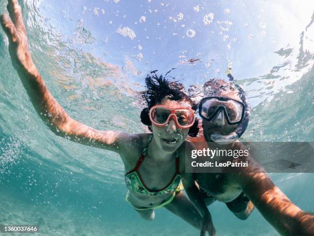 woman swimming in mauritius - wearable camera stock pictures, royalty-free photos & images