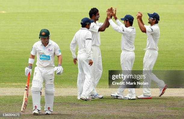 Zaheer Khan of India celebrate with team mates after bowling David Warner of the Chairmans XI during day two of the International Tour match between...