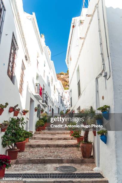 view of one of the streets of the beautiful village of frigiliana, in the province of malaga. - málaga province stock-fotos und bilder