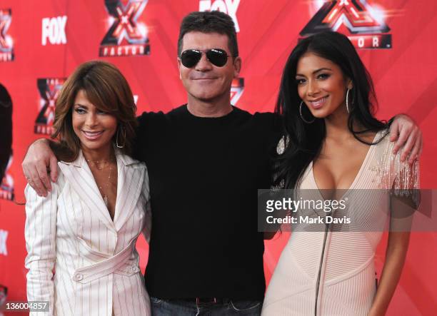 Judges Paula Abdul, Simon Cowell and Nicole Scherzinger pose at The X Factor Press Conference at CBS Television City on December 19, 2011 in Los...
