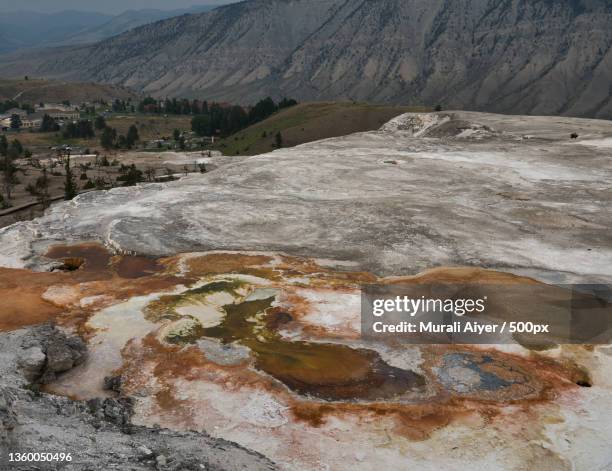 geysers of yellowstone,scenic view of landscape against sky,yellowstone caldera,wyoming,united states,usa - smokey mountain spring stock pictures, royalty-free photos & images