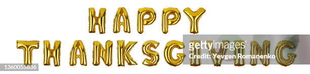 happy thanksgiving lettering made of foil balloons isolated on white background - happy thanksgiving text stockfoto's en -beelden
