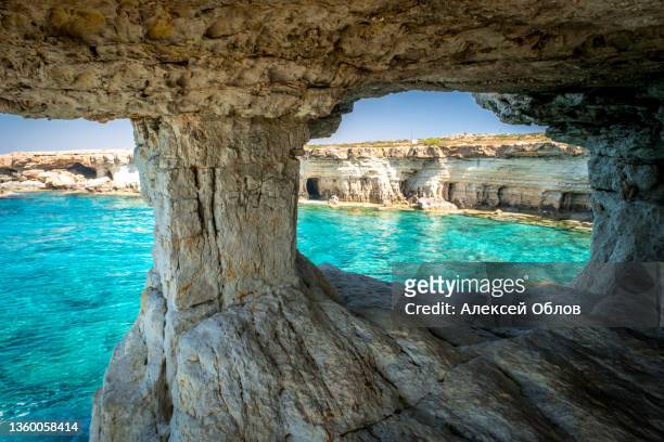 natural landmark of cyprus. sea caves in cape greko national park near ayia napa and protaras - republik zypern stock-fotos und bilder
