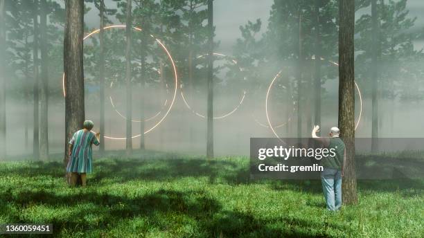 surreal abstract passages with mature couple in the forest - force field stock pictures, royalty-free photos & images