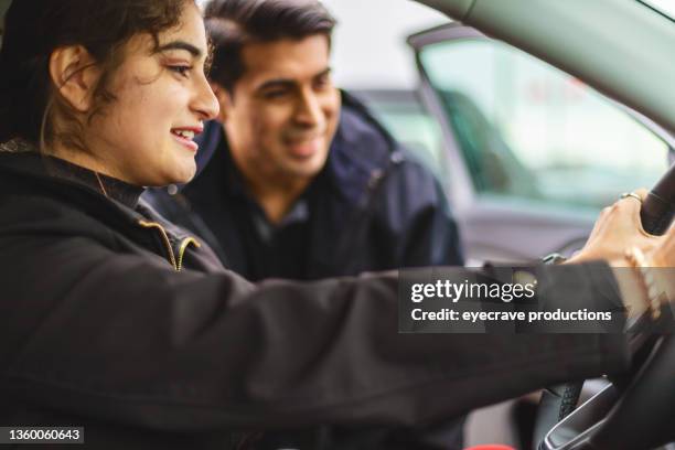 hispanic male and female siblings shopping for cars on retail car lot in western usa mexican american young adults afro-latinx lifestyle photo series - mexican american stock pictures, royalty-free photos & images