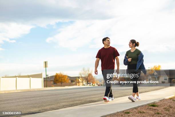 hispanic male and female siblings health and fitness walk outdoors spending quality time together mexican american young adults in western usa afro-latinx lifestyle photo series - mexican american stock pictures, royalty-free photos & images