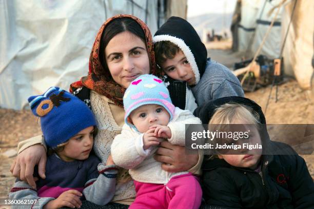 a mother with her four children in dohuk area, kurdistan region of iraq. - iraq family stock pictures, royalty-free photos & images